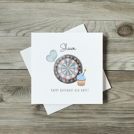 front of birthday card for dart lovers, watercolour dart board and cupcake