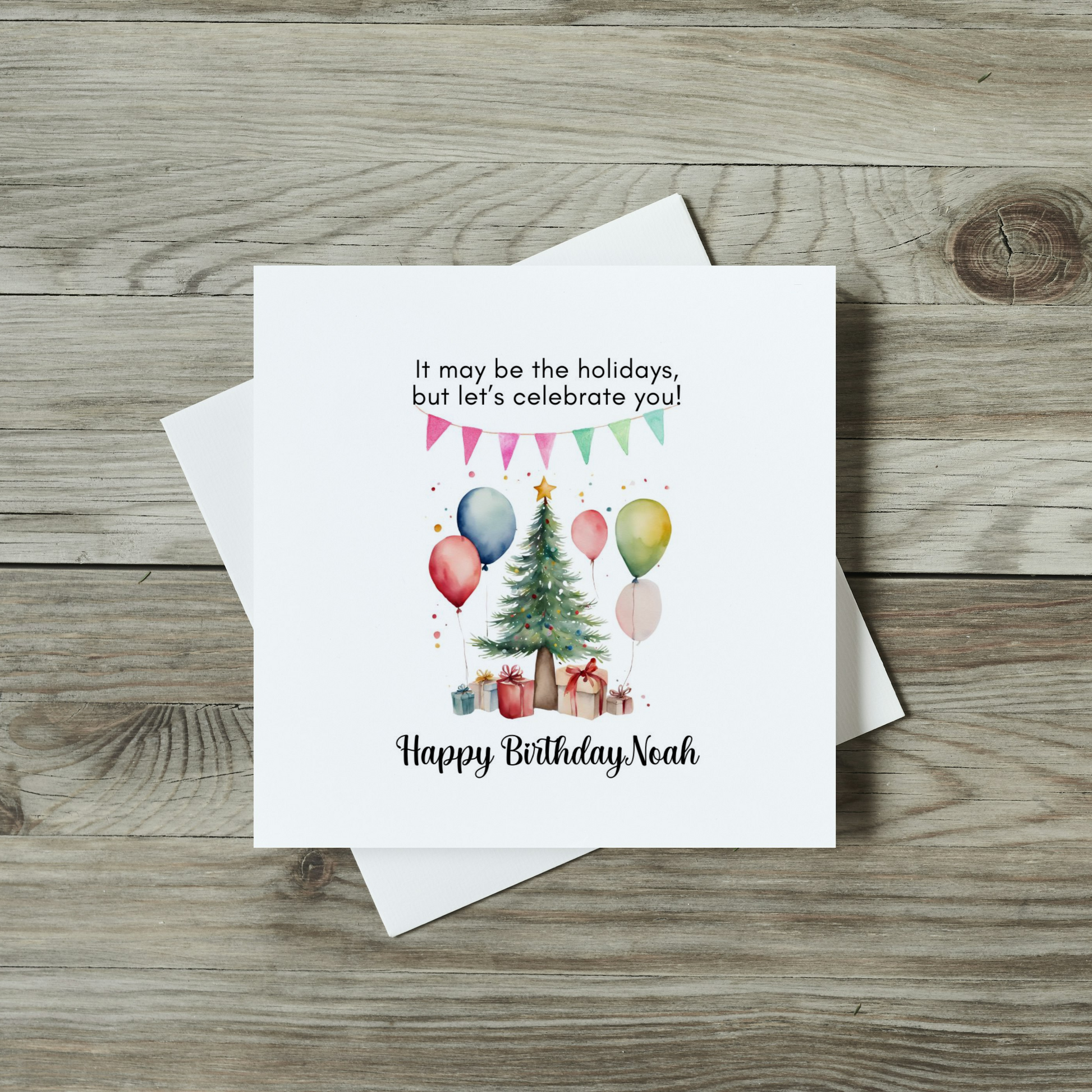 front of christmas birthday card with watercolour christmas tree and birthday balloons