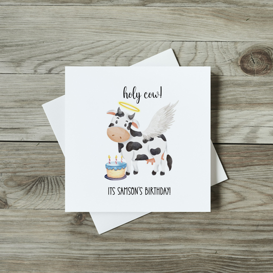 front of funny birthday card featuring cow with halo and angel wings