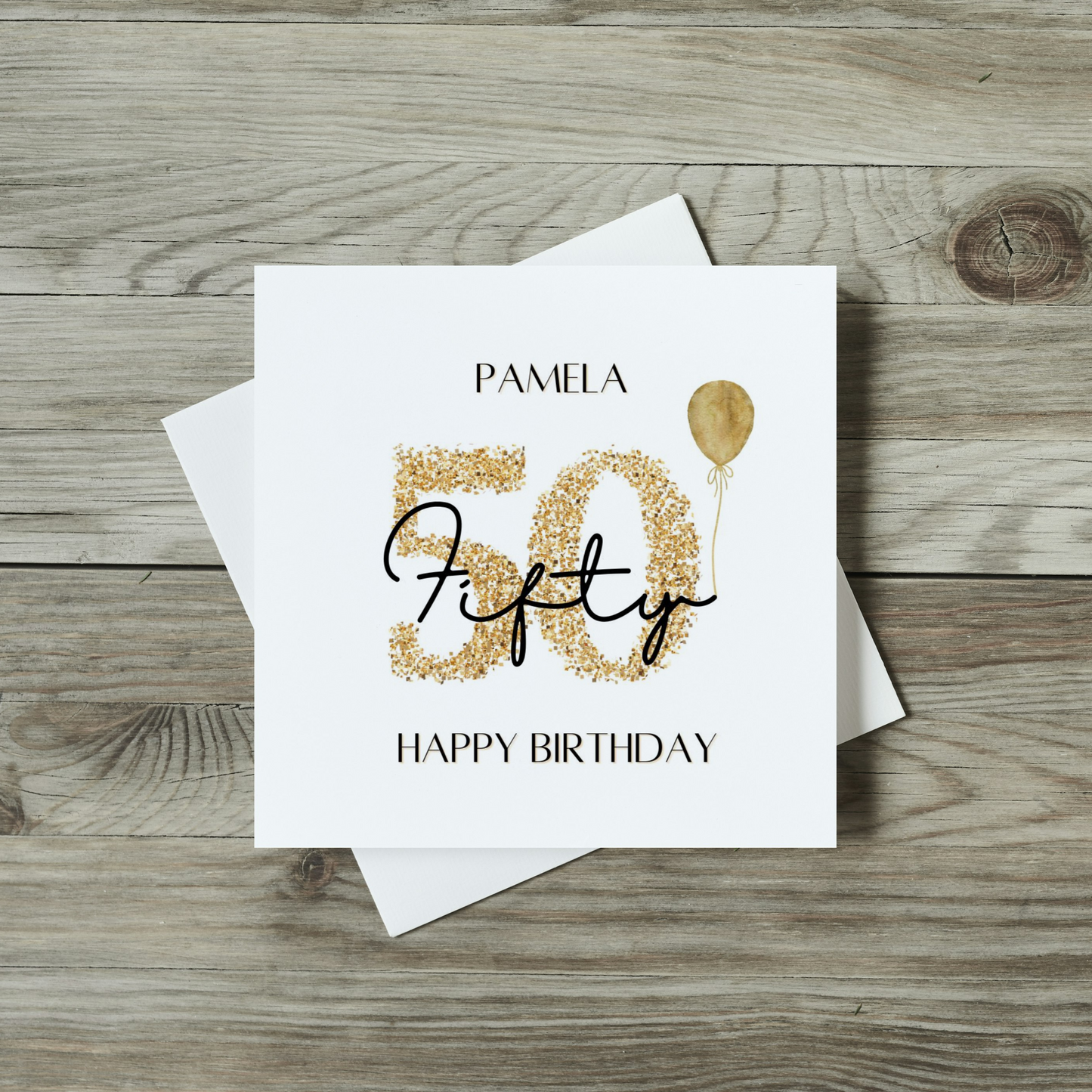 front of 50th birthday card with sparkly number and golden balloon