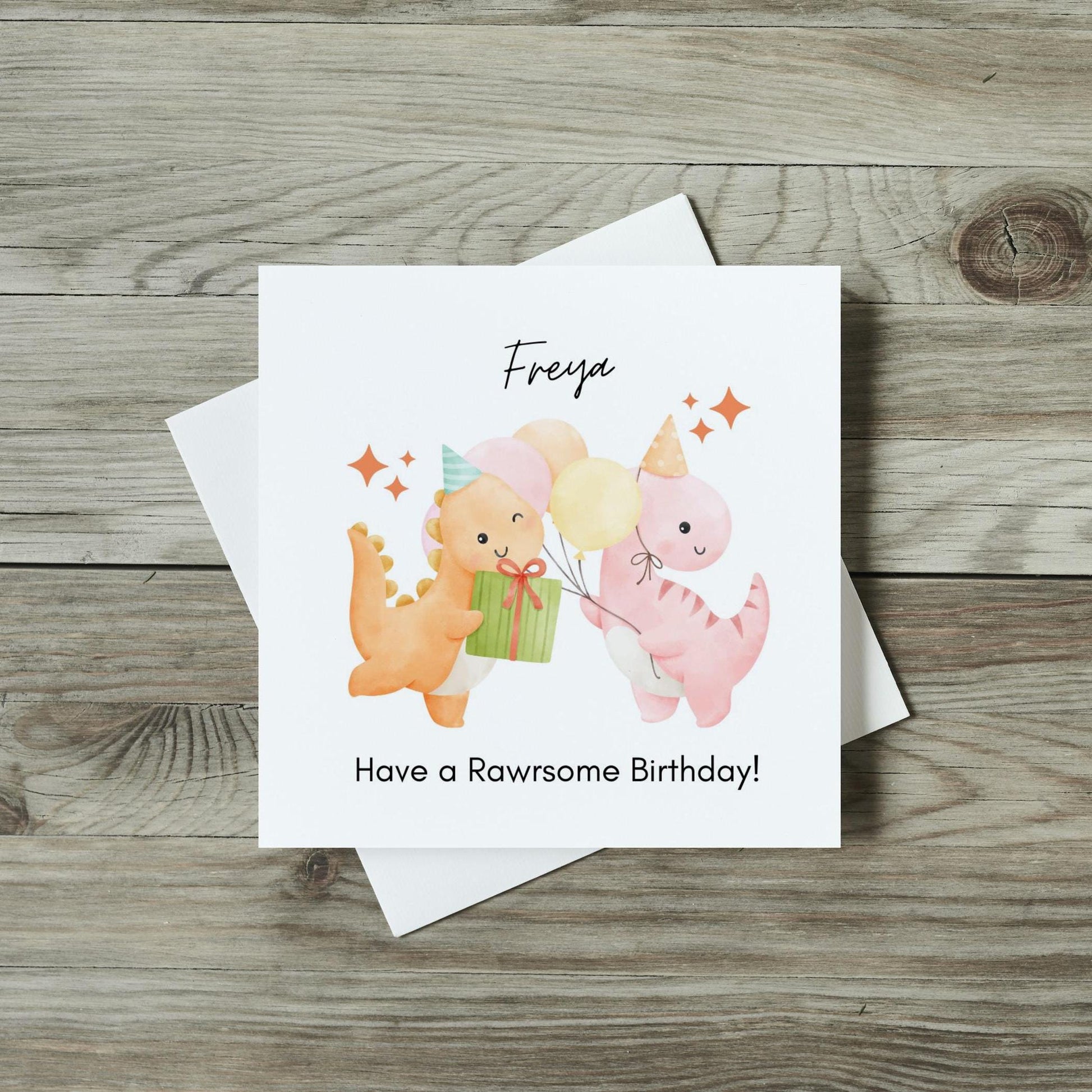 front of childrens birthday card with cute watercolour dinosaurs holding presents and balloons