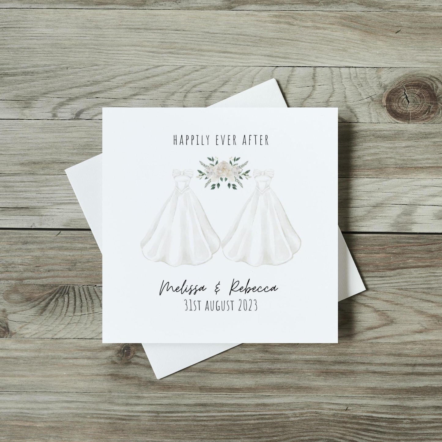 front of lesbian wedding card with two white wedding dresses